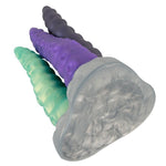 Triple Tentacle fantasidildo med tre fleksible armer i lilla, grønt og grått, laget av kroppssikker silikon.