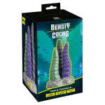 Triple Tentacle fantasydildo i grønn, lilla og grå, med sugekoppbase og strukturert overflate.