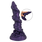 Lilla, tentakelinspirert fantasidildo med metallisk glans, sugekopp og strukturert skaft.
