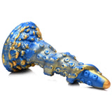 Kraken Blå Fantasy Dildo: Blå og gullfarget silikondildo med tentakelform, sugekopper og bølgende tekstur.