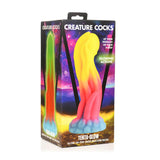 TentaGlow glødende tentakeldildo i silikon, flerfarget med sugekopper, i emballasje.