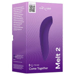 Lilla We-Vibe Melt 2 lufttrykksvibrator i sin emballasje, med produktnavn og funksjoner.