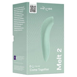 We-Vibe Melt 2 lufttrykksvibrator i dus grønn silikon, vist i sin elegante produktemballasje.