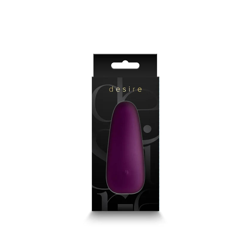 Luksuriøs Desire Kama klitorisvibrator i dyp lilla silikon, vist i elegant svart emballasje.