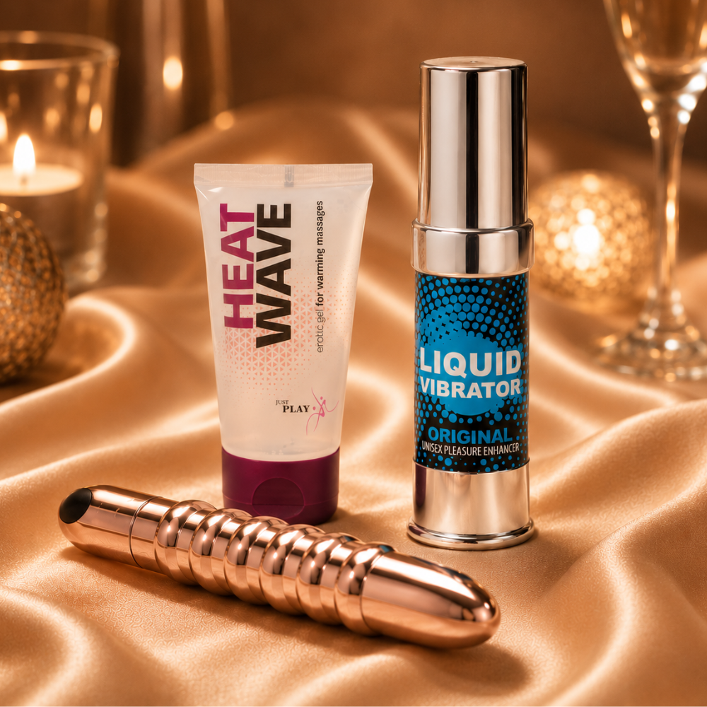 Date Night-pakken med rosegull LOLA stimulator, Heat Wave gel og Liquid Vibrator på sateng.